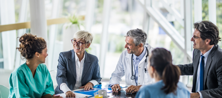 A mix of business and medical professionals in business meeting or conference 